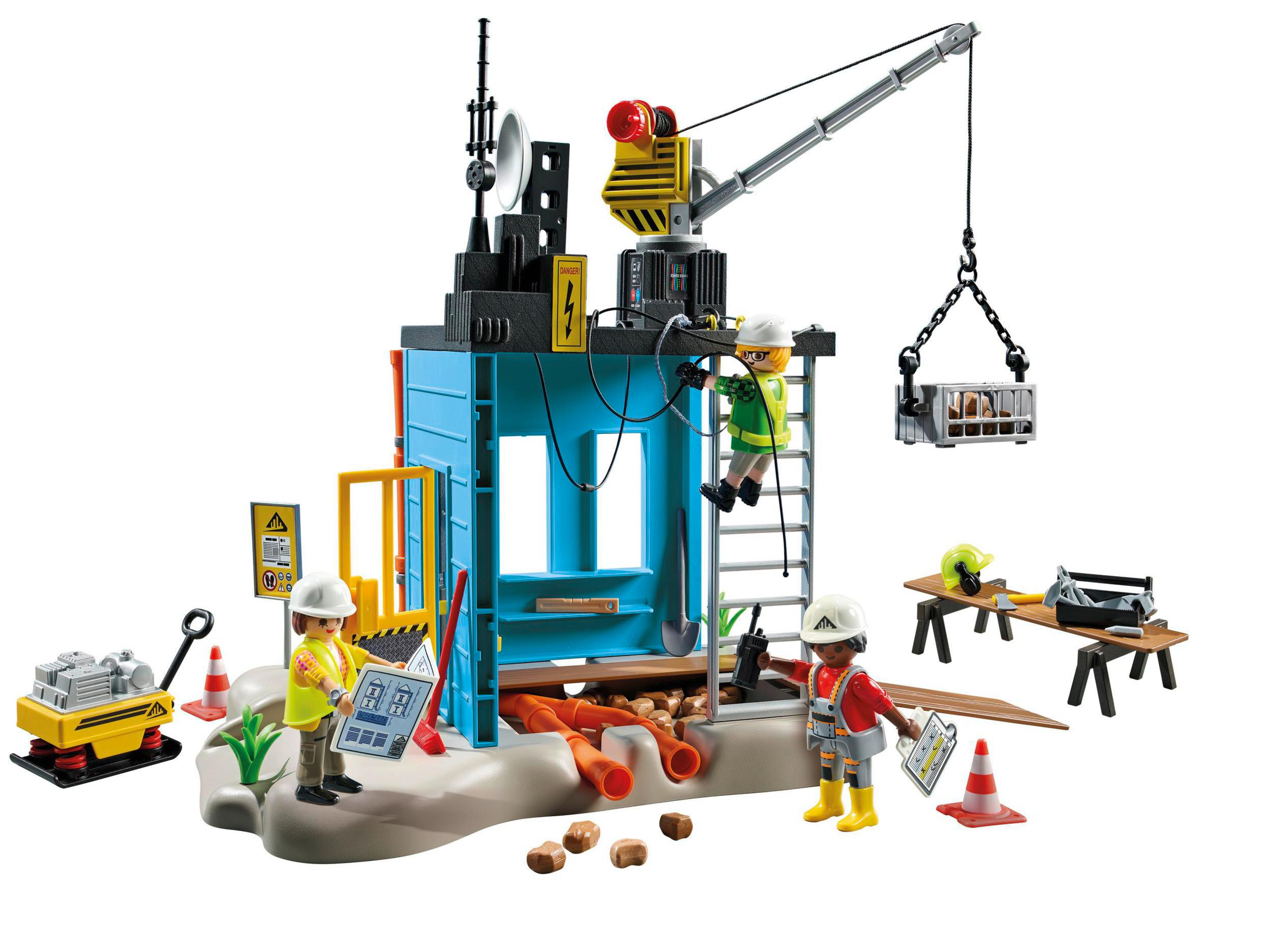 Cantiere Playmobil con operai, gru e materiali edili. Include personaggi e attrezzature.