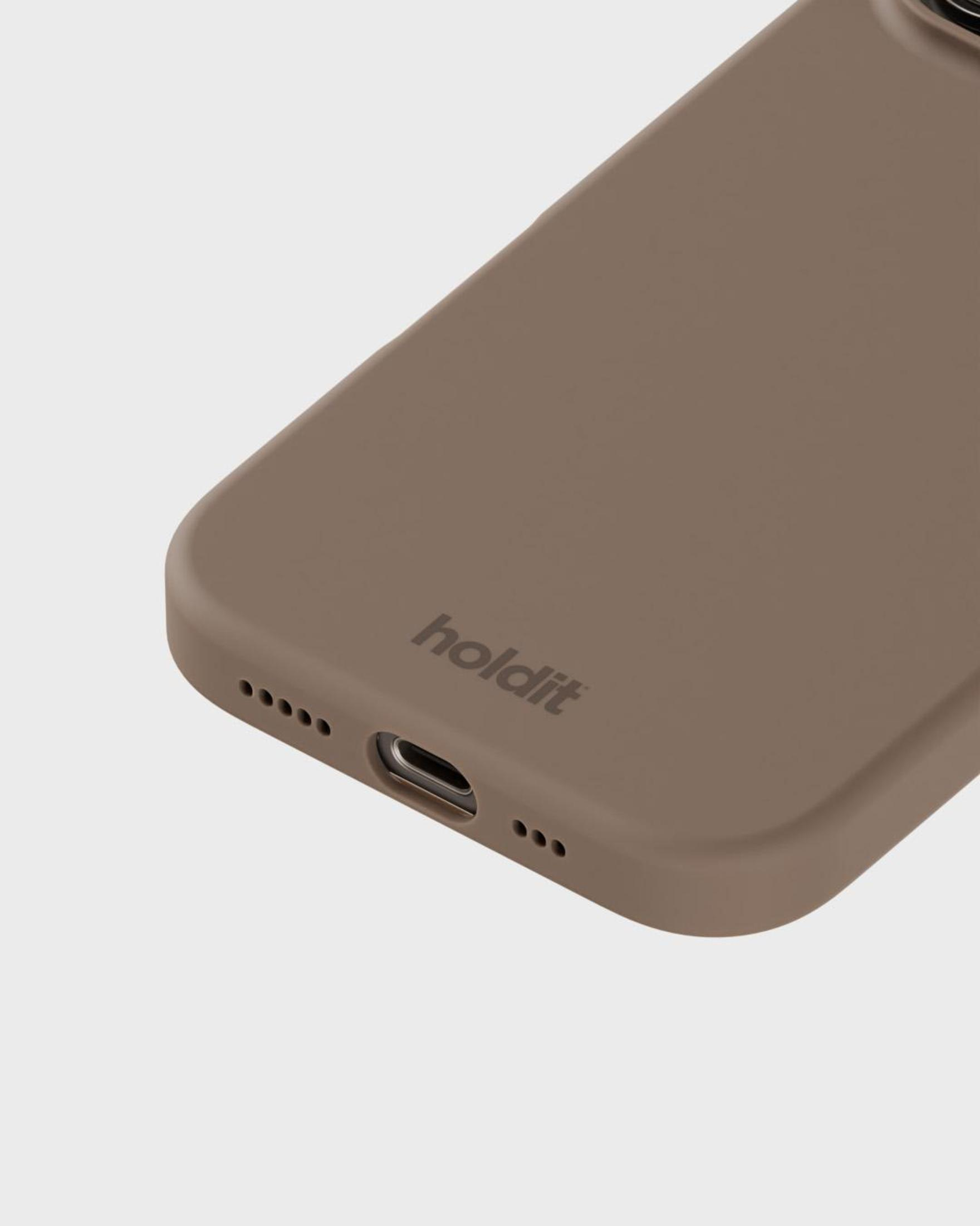 Eine beige Handyhülle mit dem Wort "holdit" unten. Handyhülle auf hellem Hintergrund.