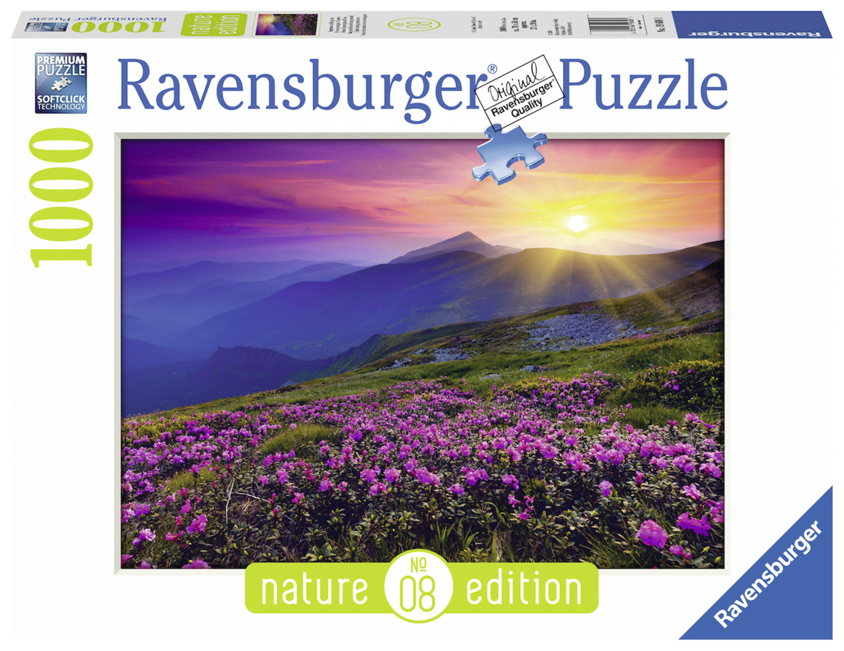 Eine Puzzledose mit einer Berglandschaft mit Blumen und Sonnenuntergang.