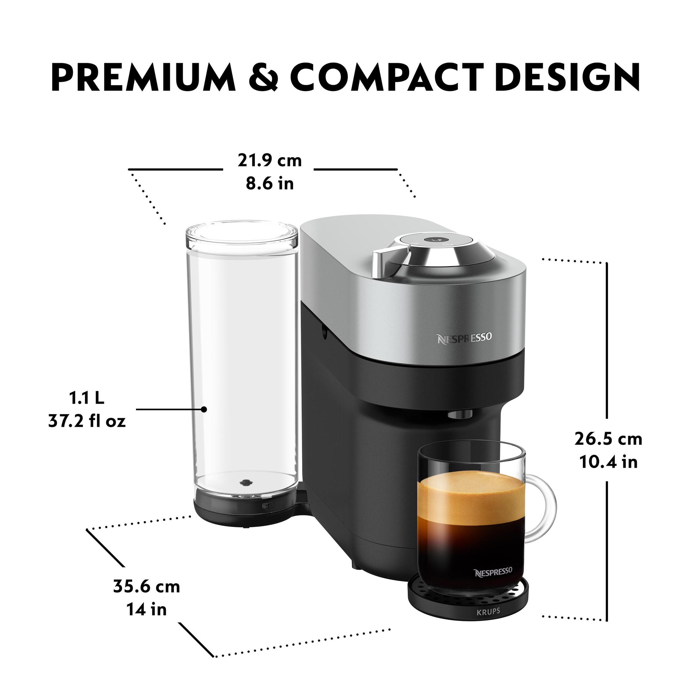 Macchina per caffè con misure in cm e pollici. Contenitore dell'acqua a sinistra.
