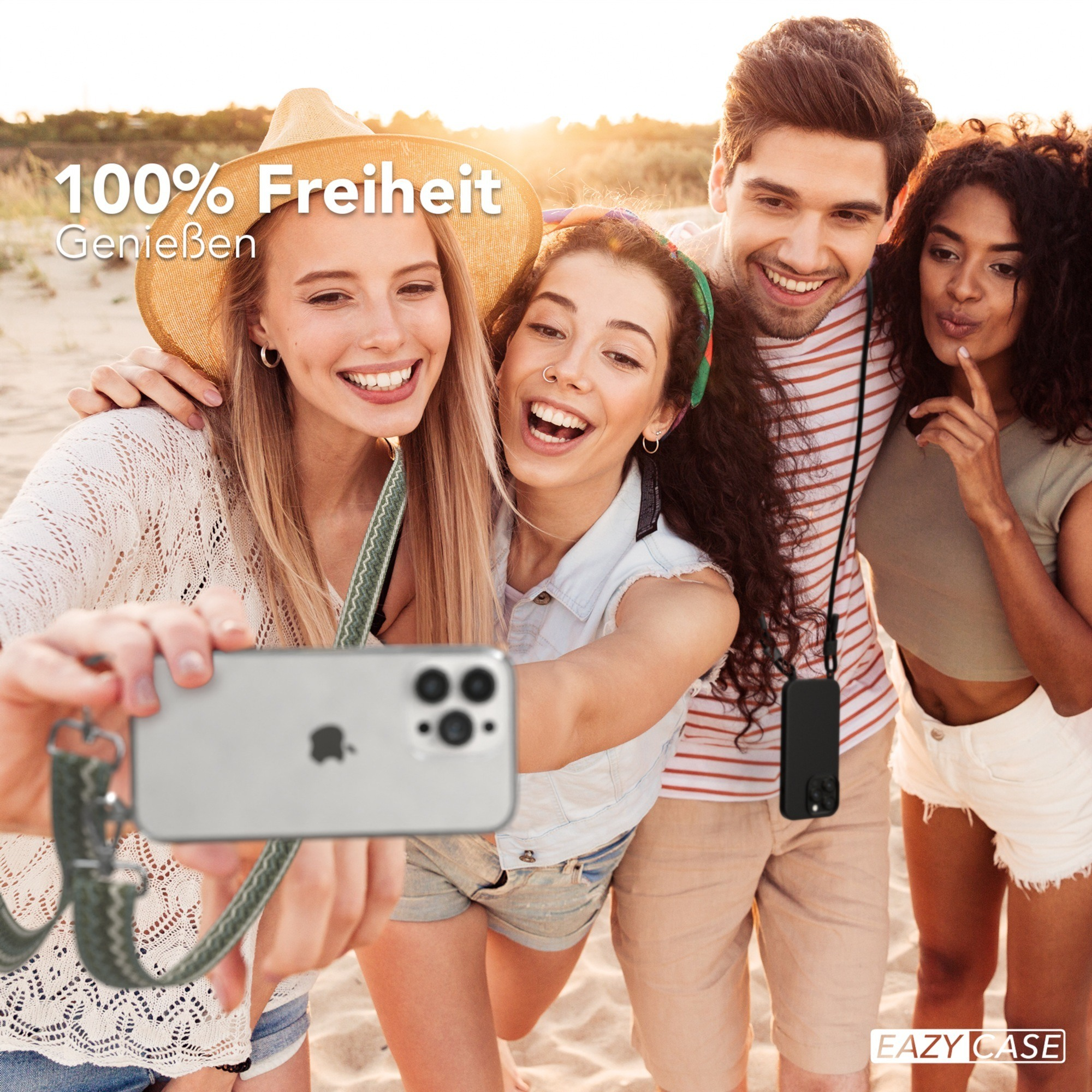 Eine Frau und ein Hund am Strand mit einem Telefon an einer Schnur.