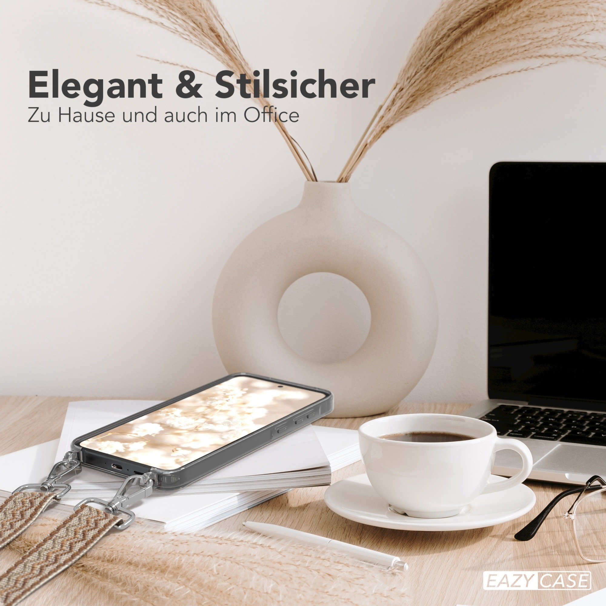 Telefon auf einem Schreibtisch mit Kaffeetasse, Stift und Pflanze, mit dem Text "Elegant & Stilicher".