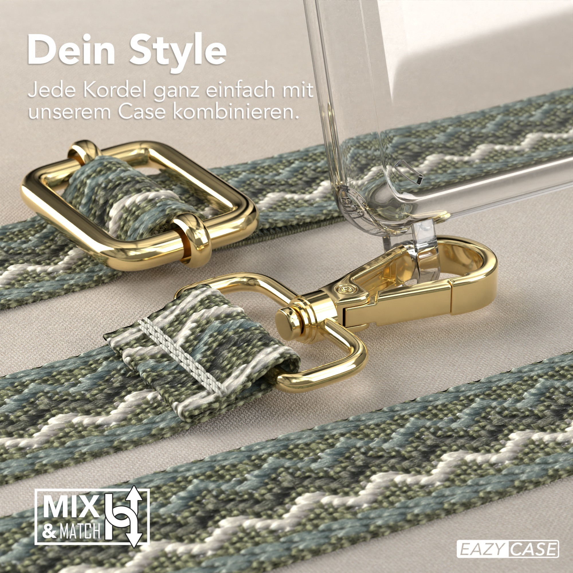 Nahaufnahme des Handybandes mit goldener Hardware und einem grün-weißen Webmuster, transparente Handyhülle.