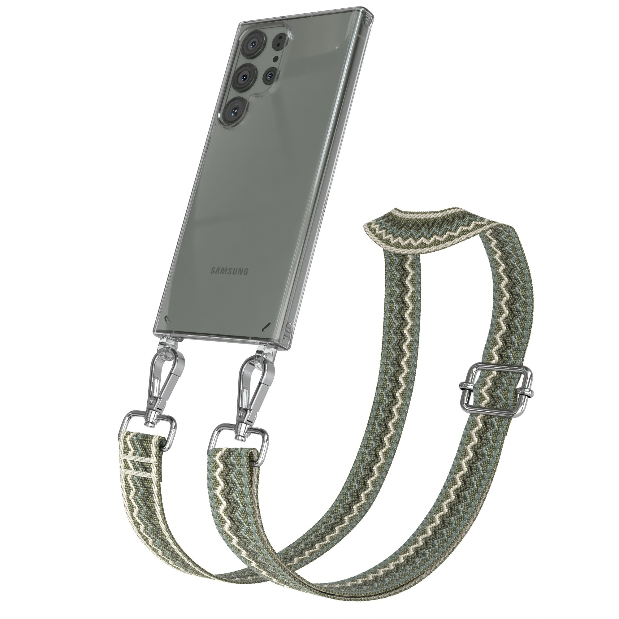 Transparente Handyhülle mit grün-weiß gemustertem Riemen. Der Riemen ist mit einer Metallschnalle verstellbar. Ein Telefon ist sichtbar.