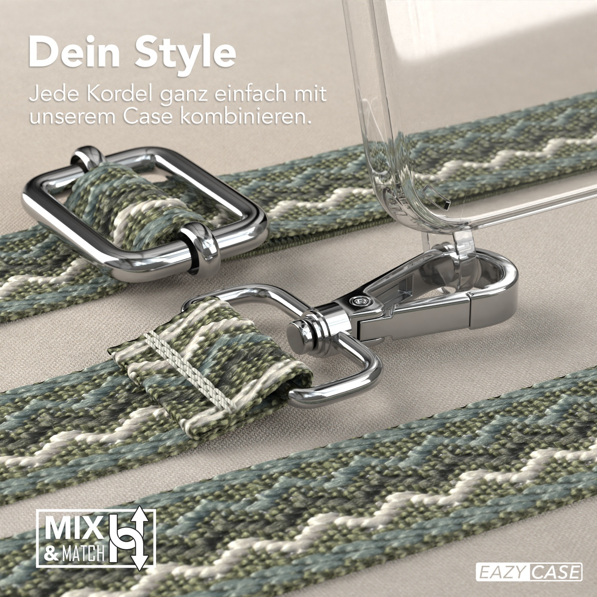 Eine transparente Handyhülle mit grün gemustertem Riemen und silberner Hardware wird auf hellbeigem Untergrund gezeigt.