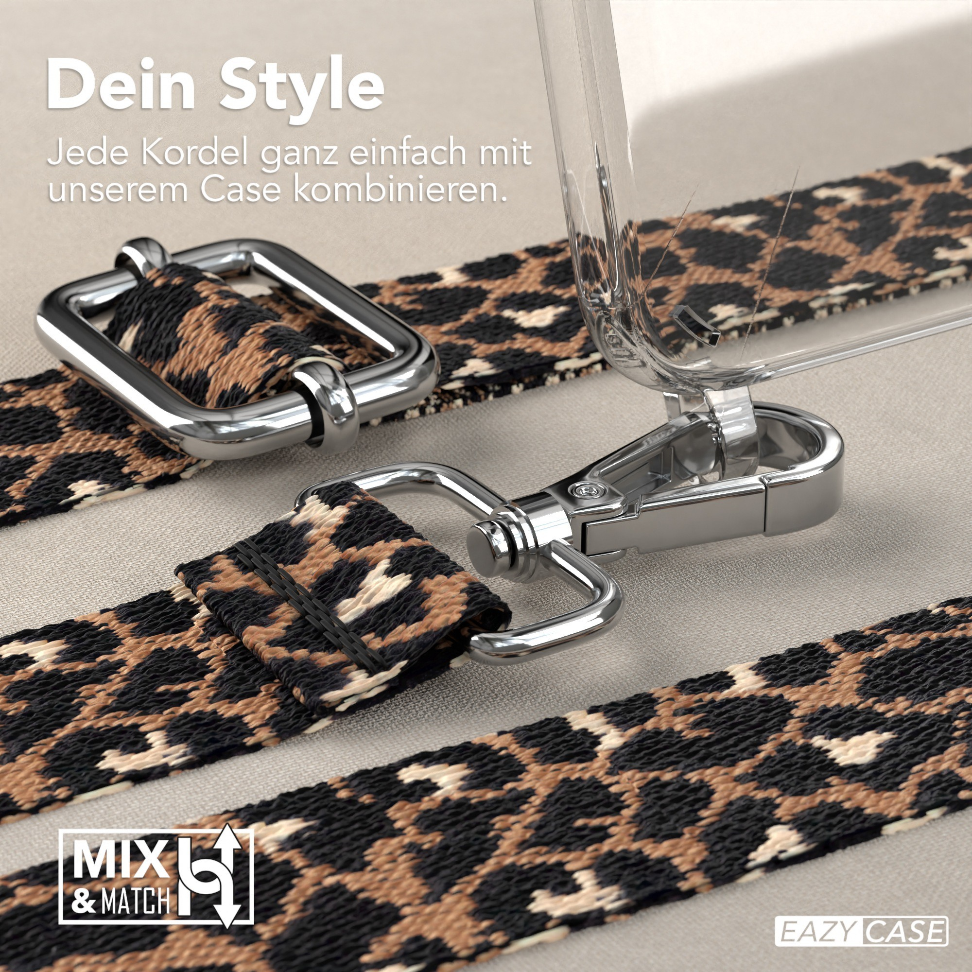 Nahaufnahme von Leopardenmuster-Handyband und klarer Handyhülle mit silberner Hardware auf neutralem Hintergrund.