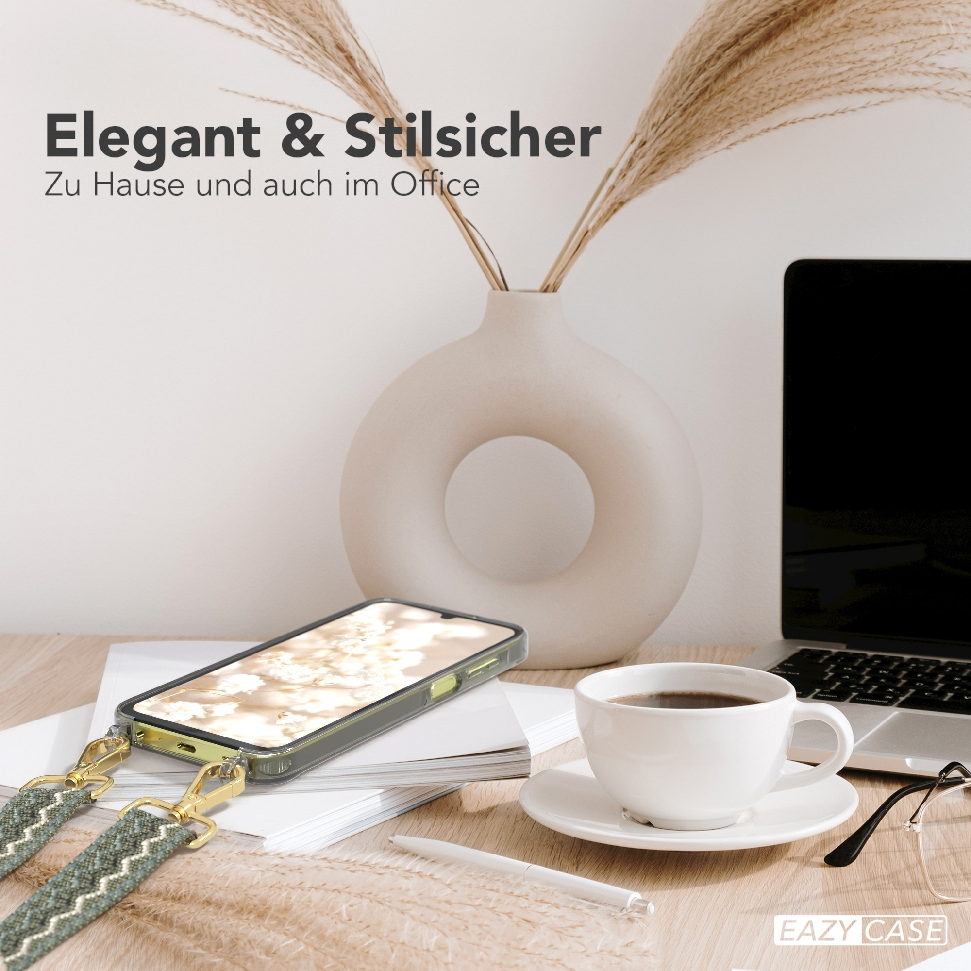 Telefon mit Hülle und Riemen, Kaffeetasse, Laptop und Vase auf dem Schreibtisch.