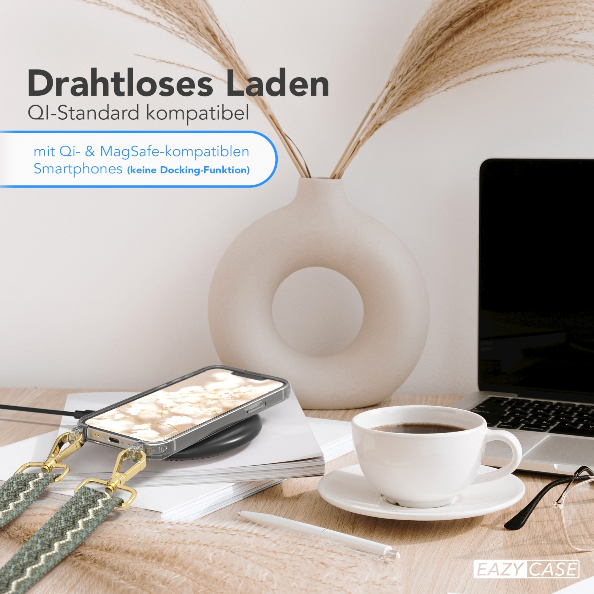 Ein Telefon mit transparentem Gehäuse wird kabellos geladen, mit Kaffeetasse und Laptop.