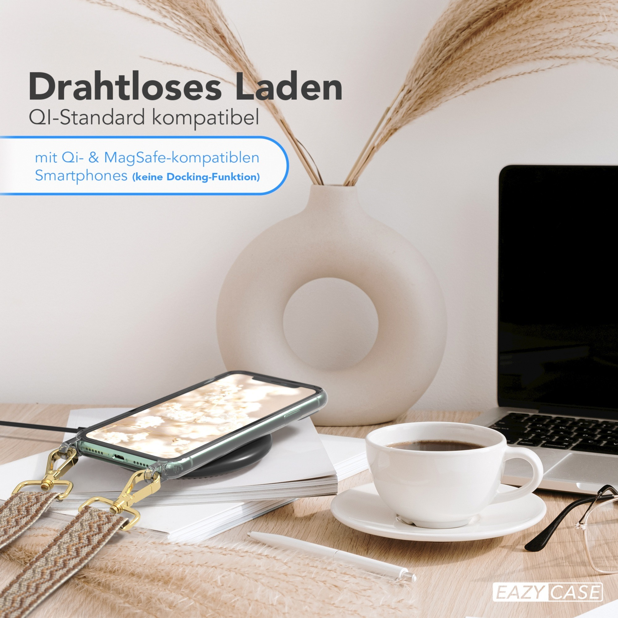 Ein Telefon auf einem Ladegerät, Kaffee und Büroeinrichtung mit Text zum kabellosen Laden.
