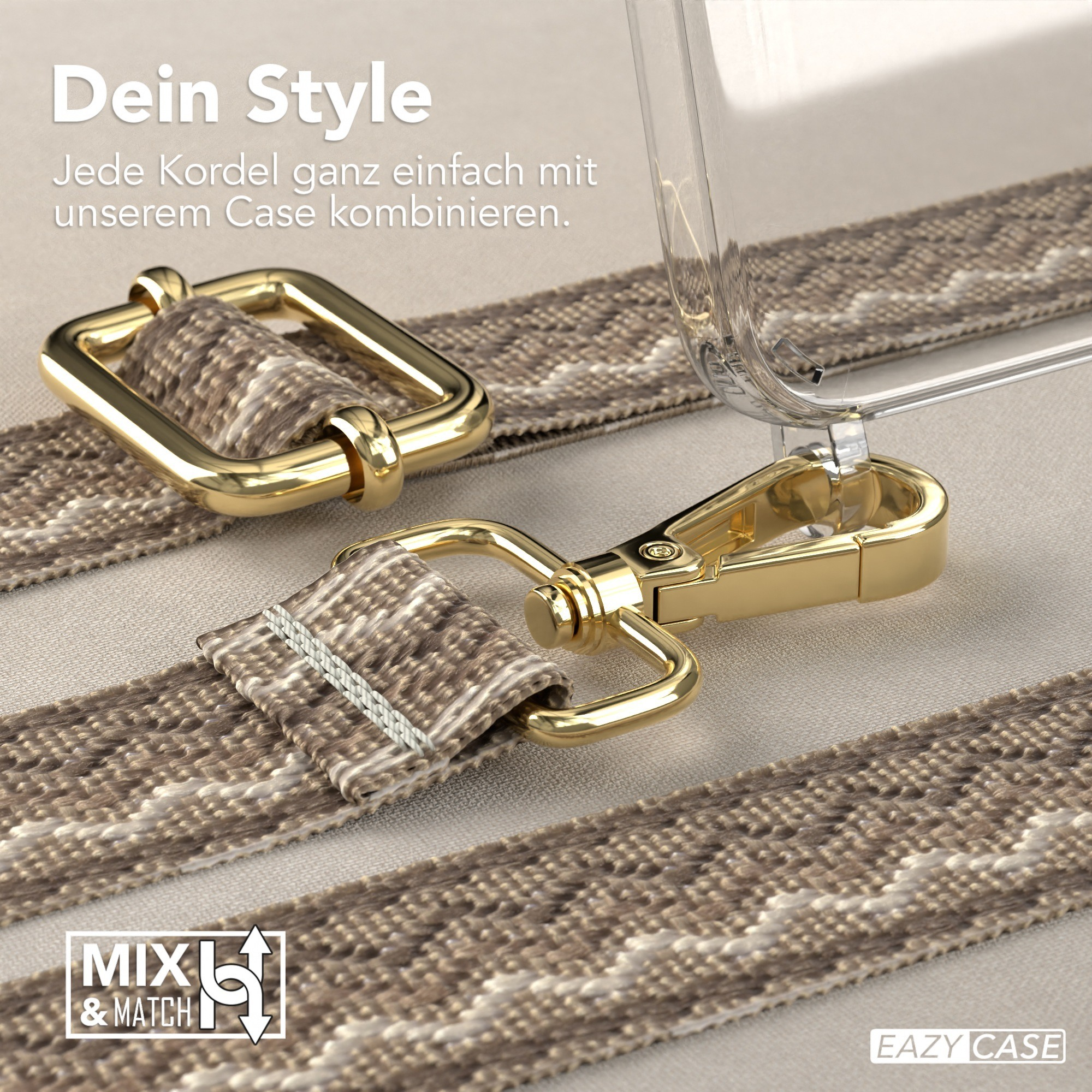 Nahaufnahme von Handyband-Hardware. Goldene Verschlüsse und ein gemustertes Band werden gezeigt.