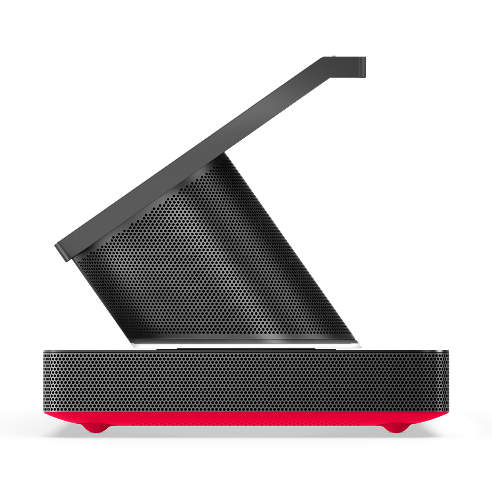 Czarny głośnik z czerwoną podstawą. Perforowany przód i góra. Kątowa konstrukcja.