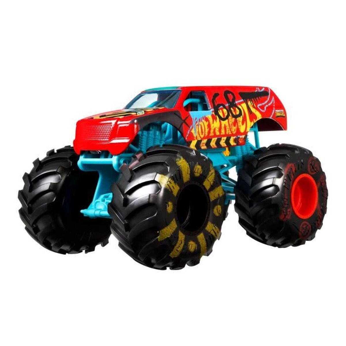 Czerwono-czarny zabawkowy monster truck Hot Wheels. Ciężarówka stoi na białej powierzchni.