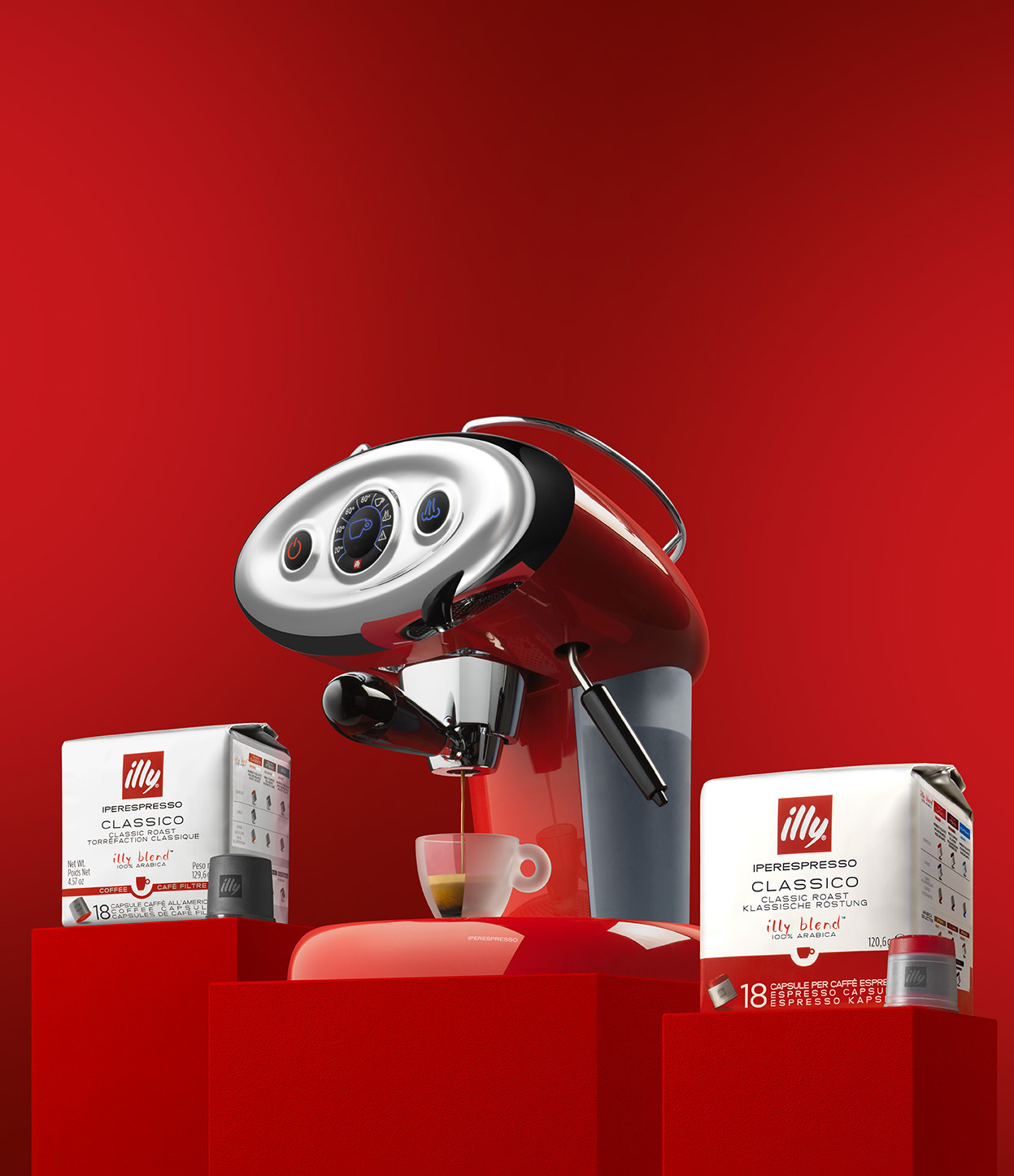 Czerwony ekspres do espresso Illy z kawą i puszkami Illy.