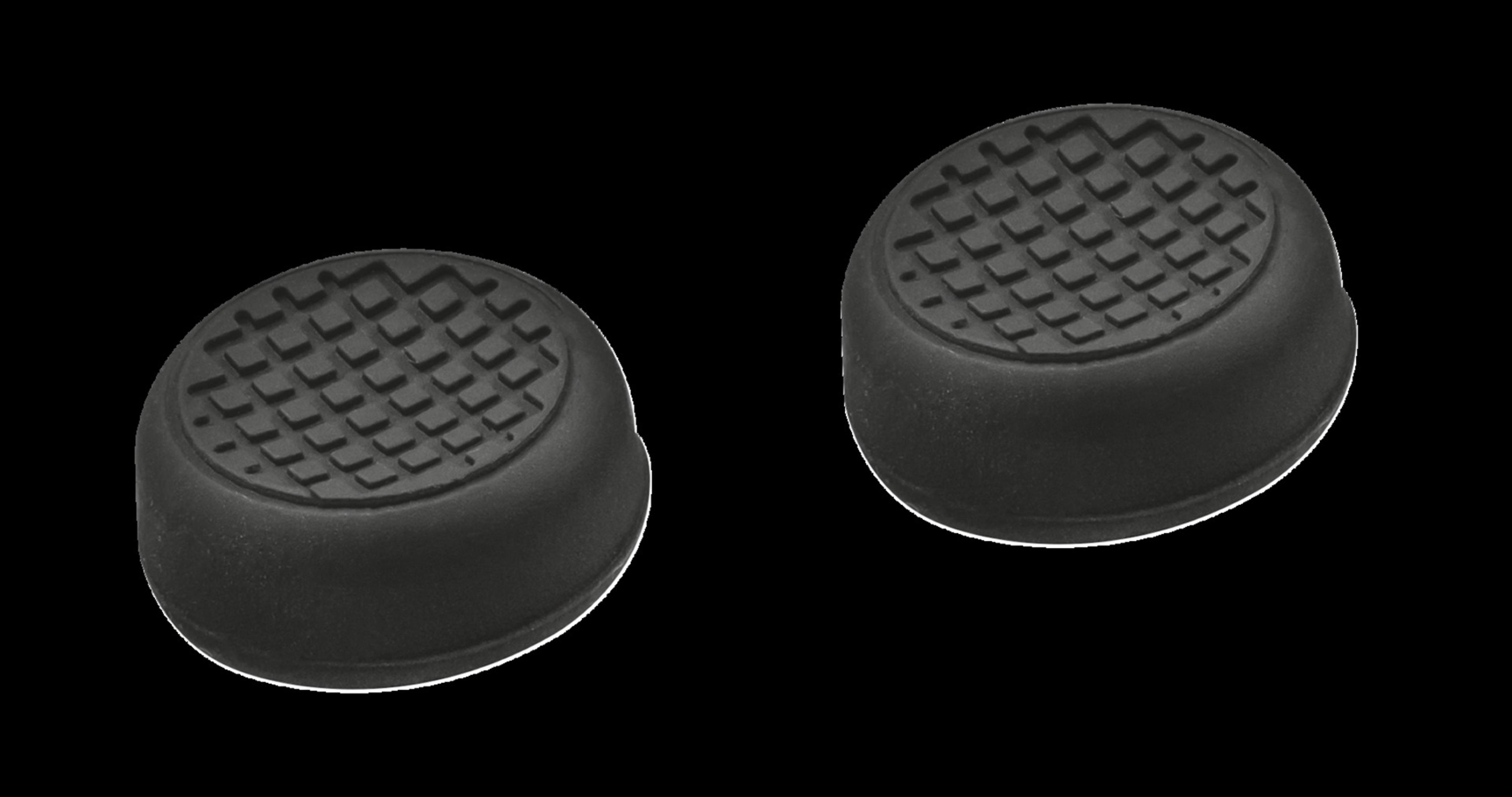 Zwei schwarze, kreisförmige Joystick-Daumengriffe, gemusterte Oberfläche, schwarzer Hintergrund.
