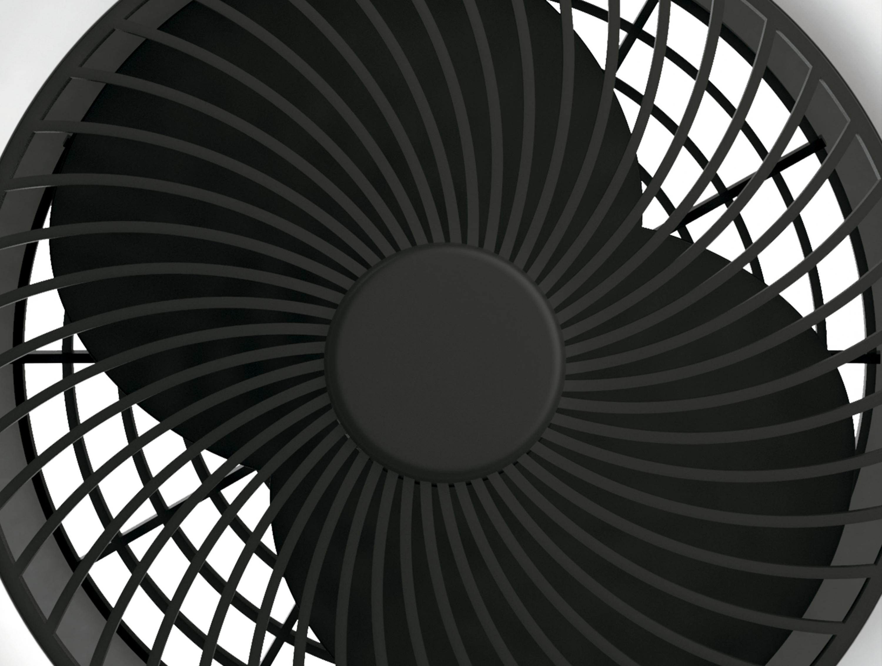 Primer plano de un ventilador negro con aspas. Las aspas forman un patrón en espiral.