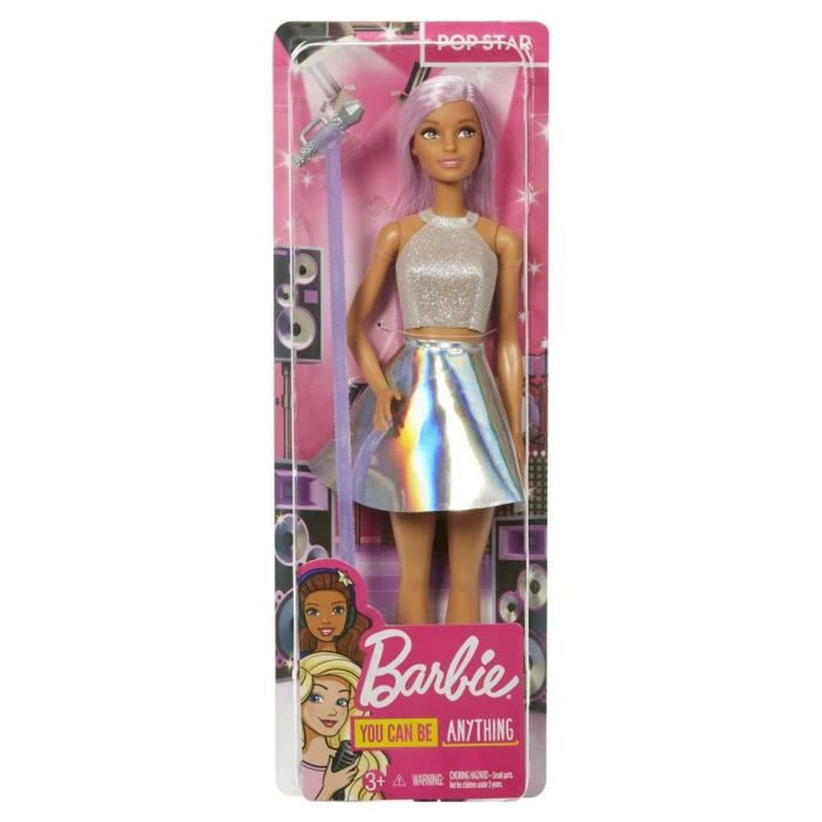 Barbie pop in een doos. Ze draagt een zilveren top en rok en houdt een microfoon vast. Tekst: 'You can be anything'.