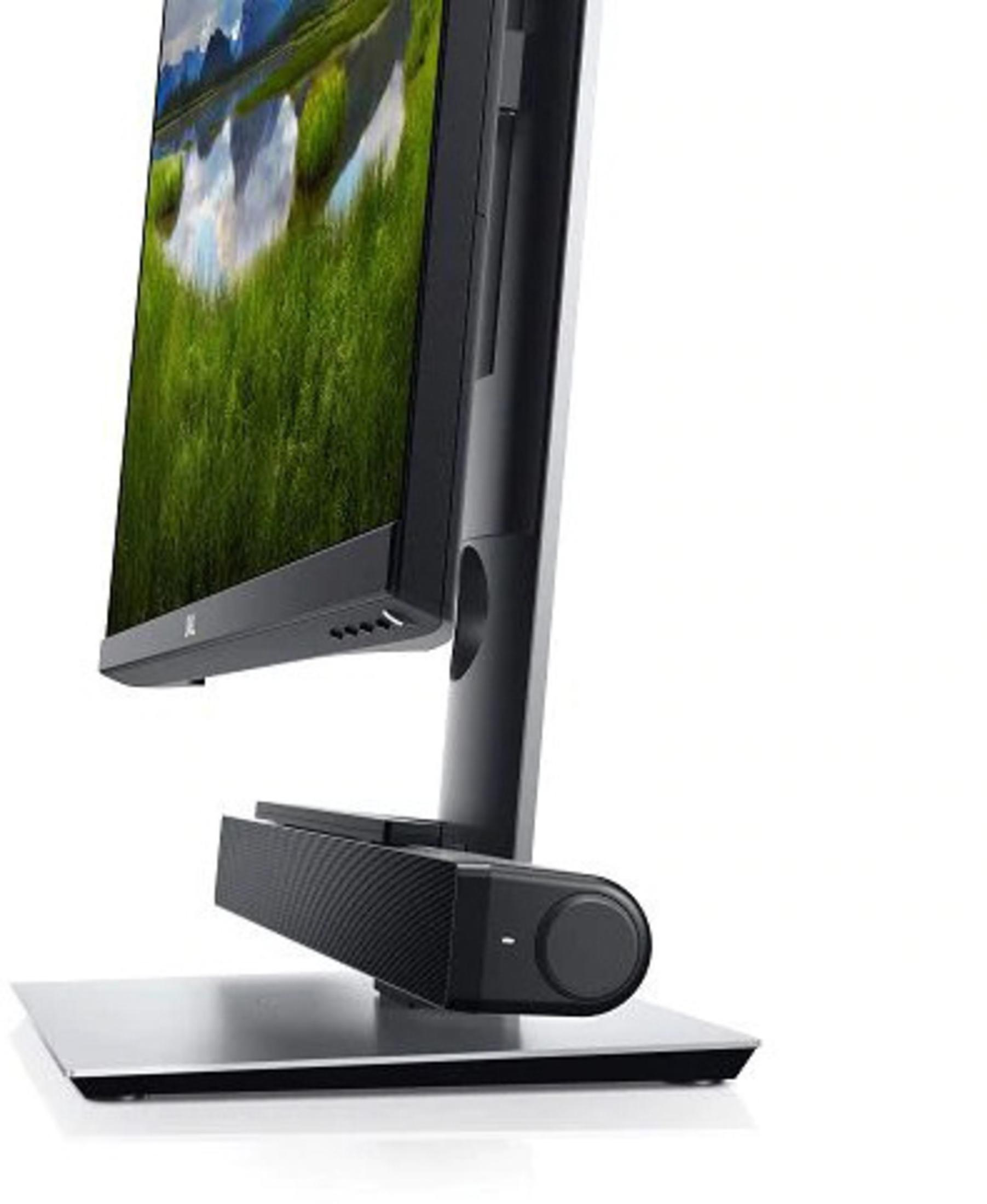 Monitor ze stojakiem. Ekran wyświetla krajobraz z zieloną trawą i wodą.