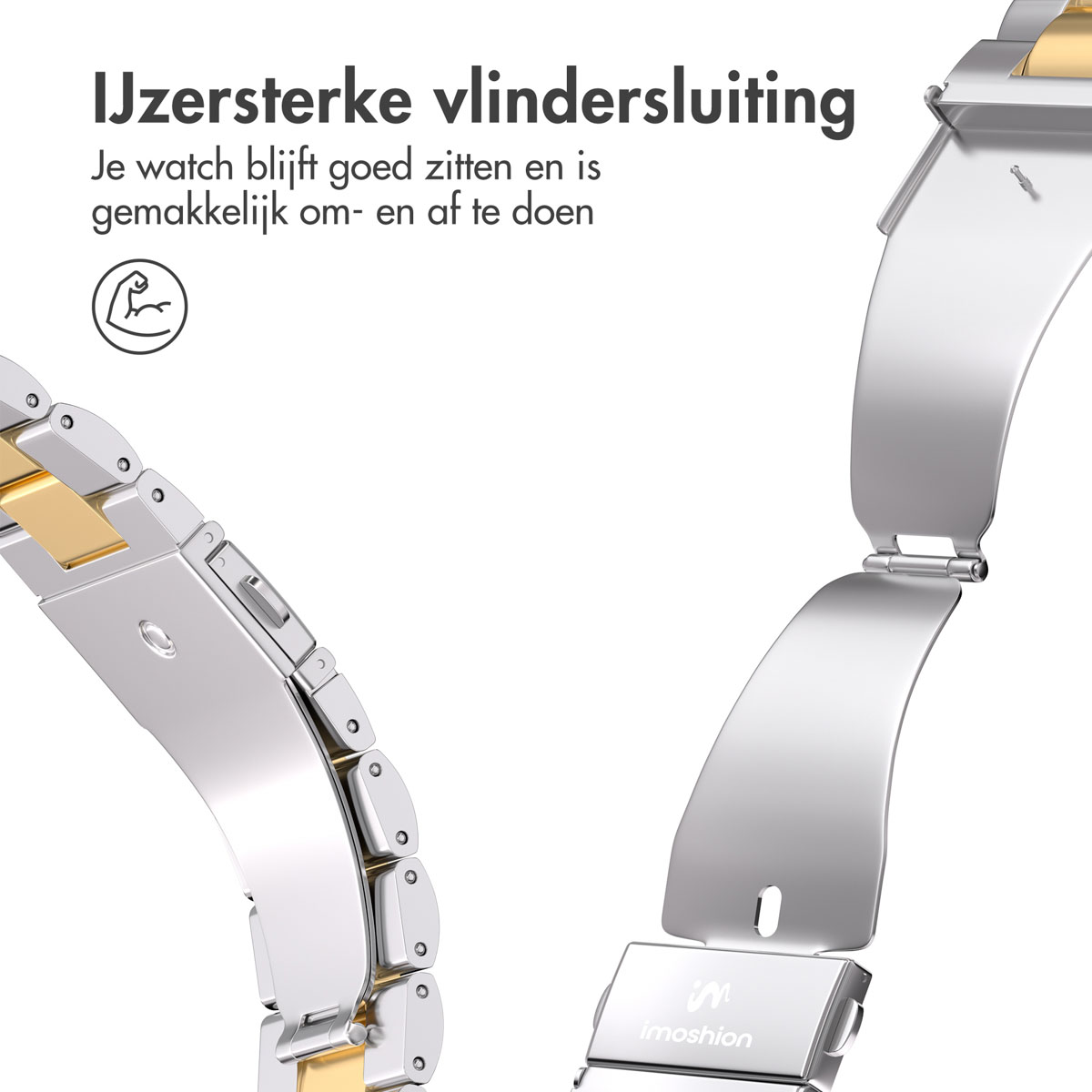 Close-up of a watch strap clasp. It is silver and gold in color and shows how it opens.
