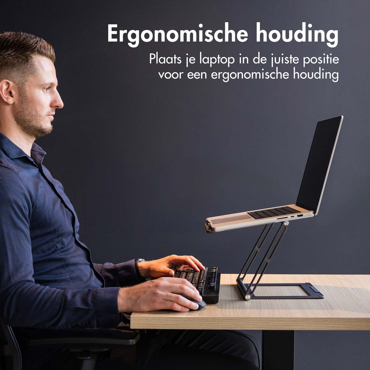 Man using a laptop on a stand with an external keyboard. Text: Ergonomic posture.