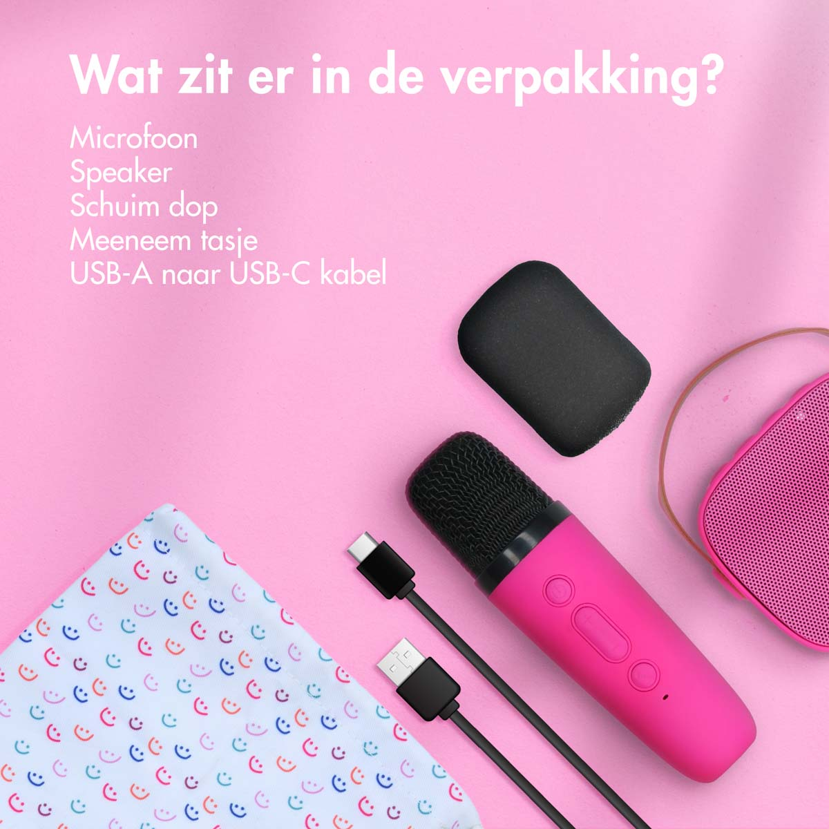 Roze microfoon en accessoires. De accessoires zitten in een roze verpakking.