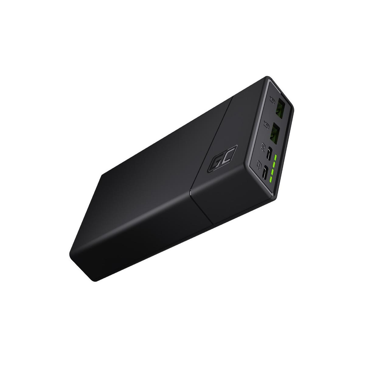 Eine schwarze Powerbank mit mehreren Anschlüssen und grünen Lichtern zur Anzeige des Ladezustands.