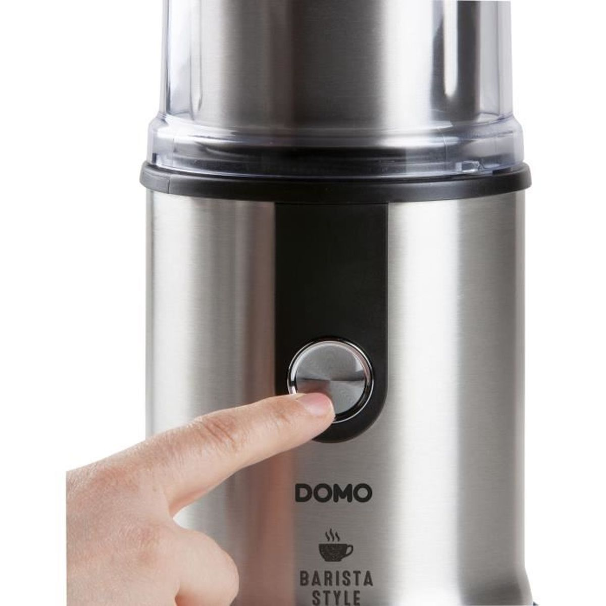 Una mano preme il pulsante argentato su un macinacaffè in acciaio inossidabile con l'etichetta 'DOMO Barista Style'.