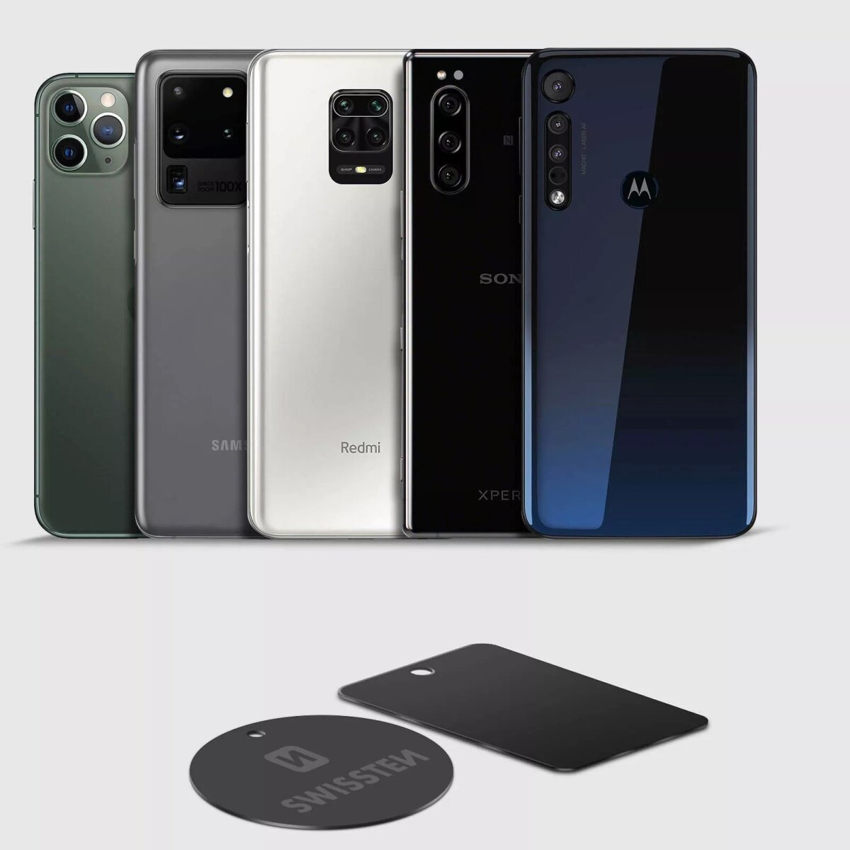 Cinque smartphone in vari colori e una calamita e piastra nere.