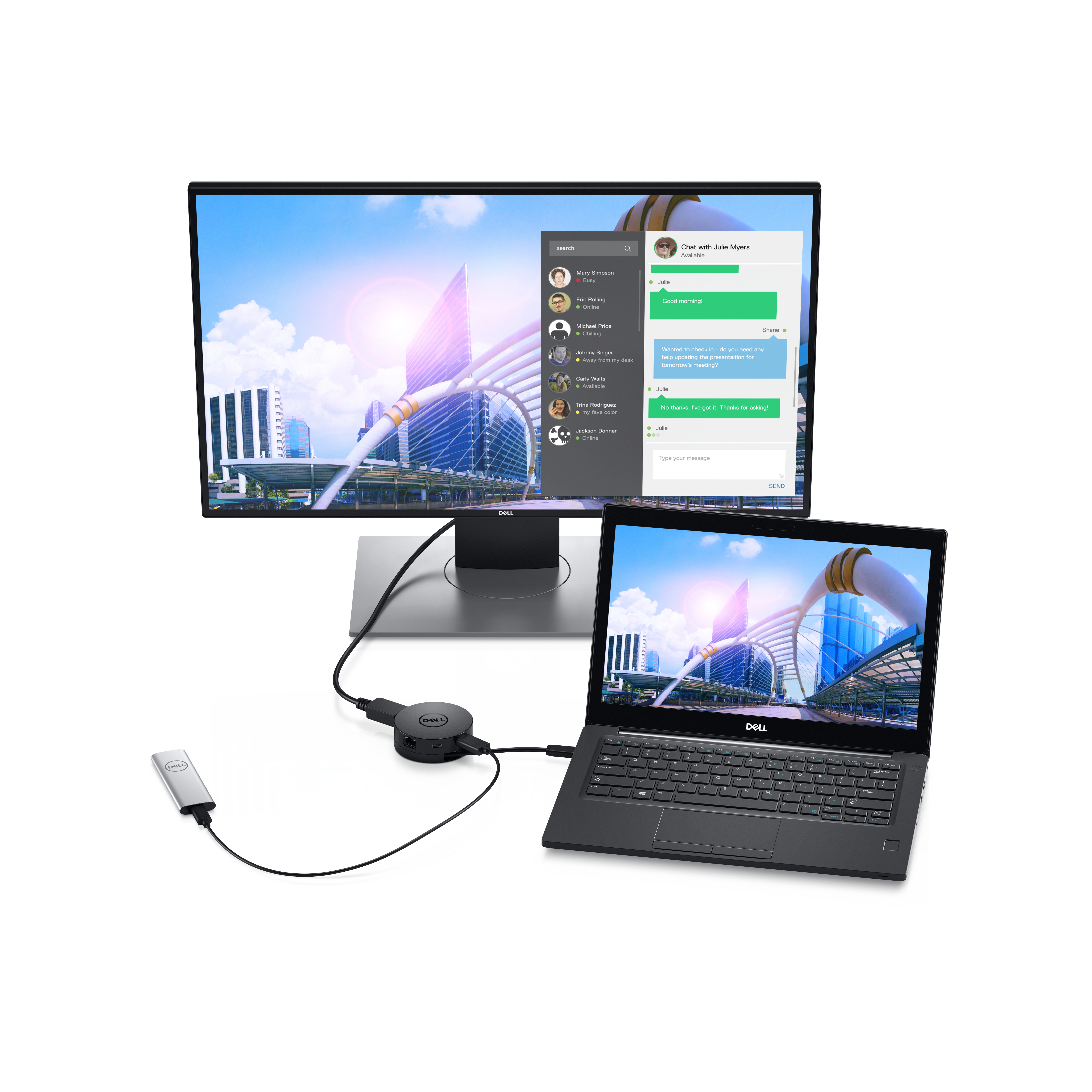 Ein Laptop ist mit einem Monitor und anderen Geräten verbunden. Der Monitor zeigt einen Chat-Bildschirm. Der Laptop ist geöffnet.