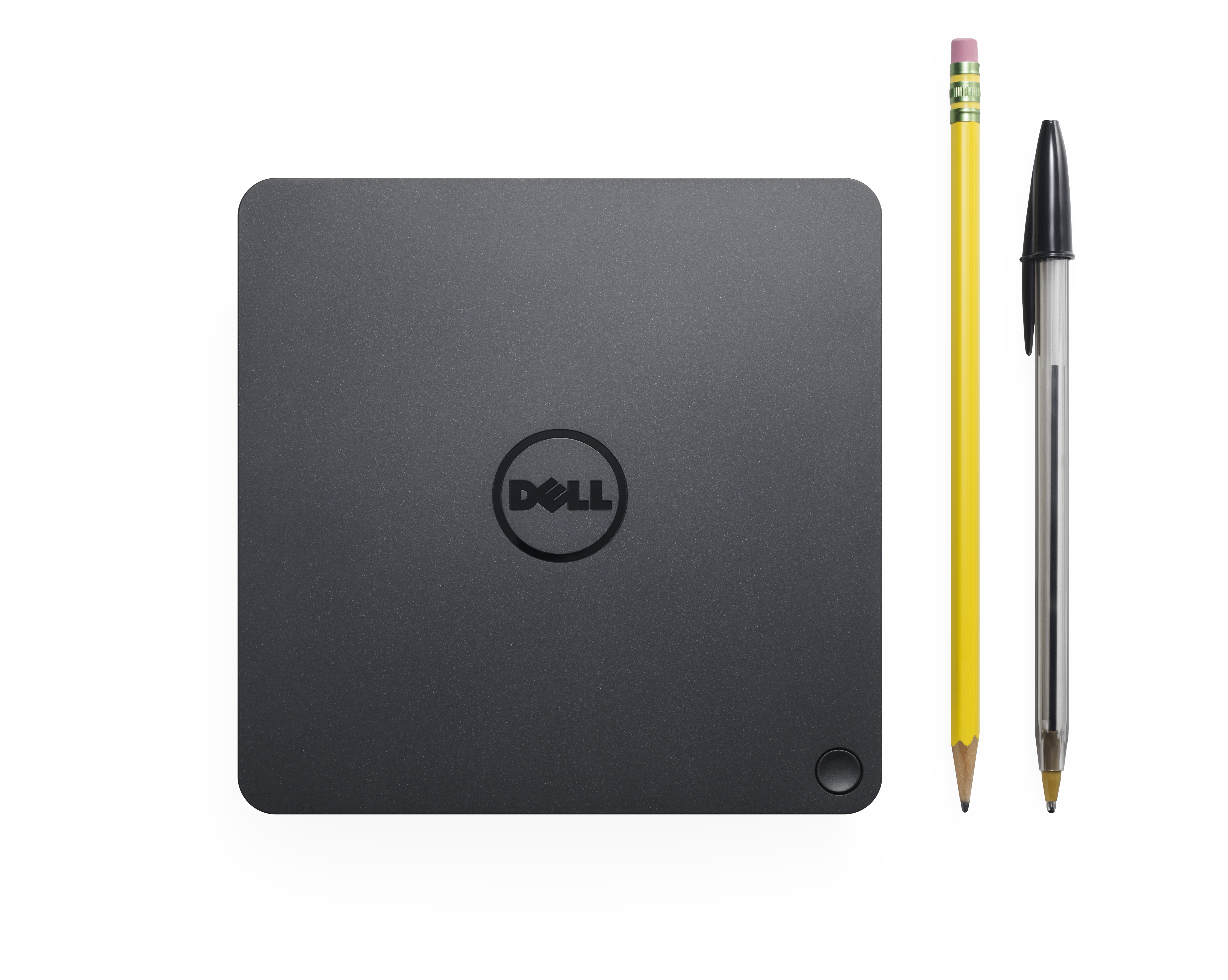 Docking station nera con logo Dell, una matita e una penna accanto, su superficie bianca.