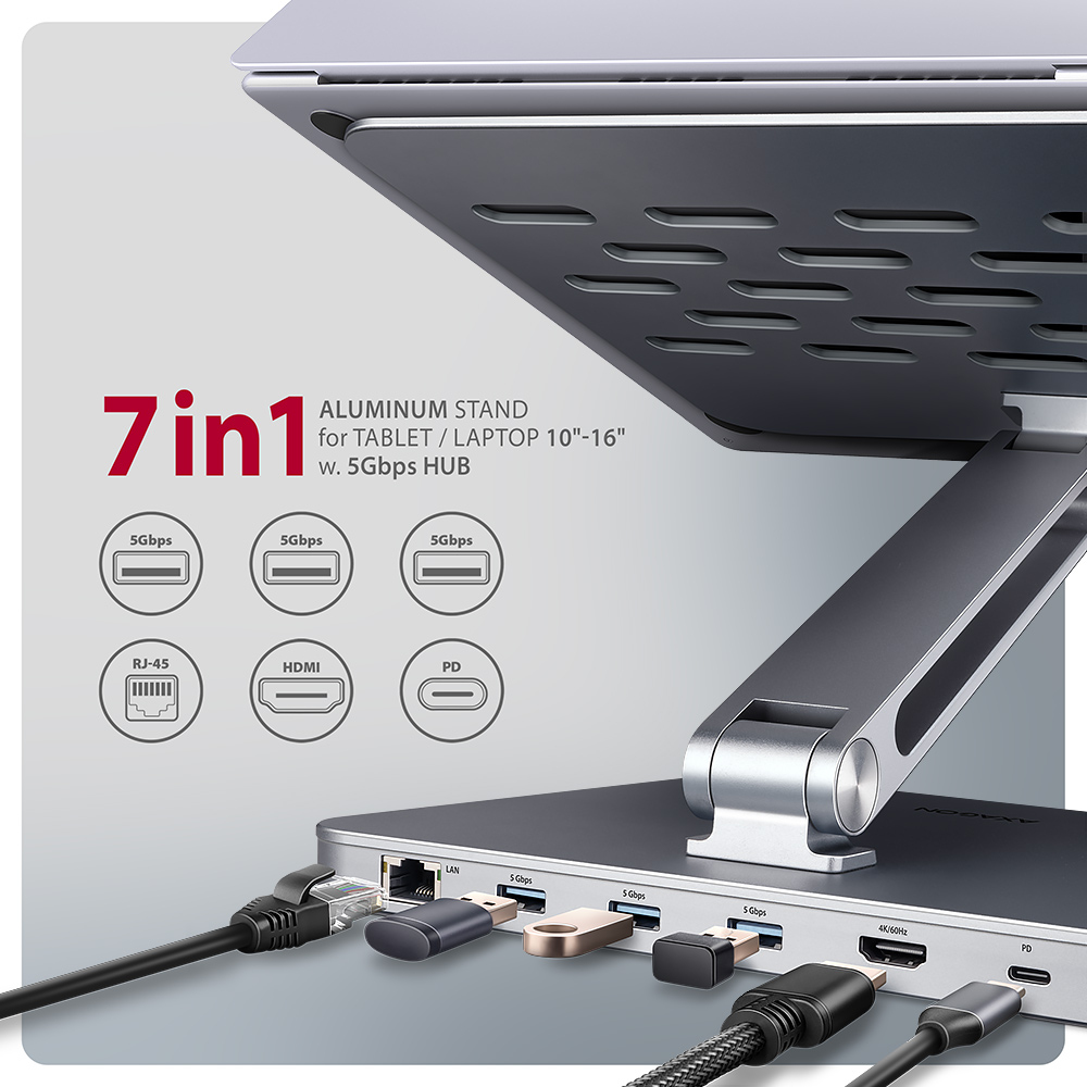 Un supporto per laptop in alluminio con più porte, cavi collegati. Il supporto ha un hub 7 in 1.