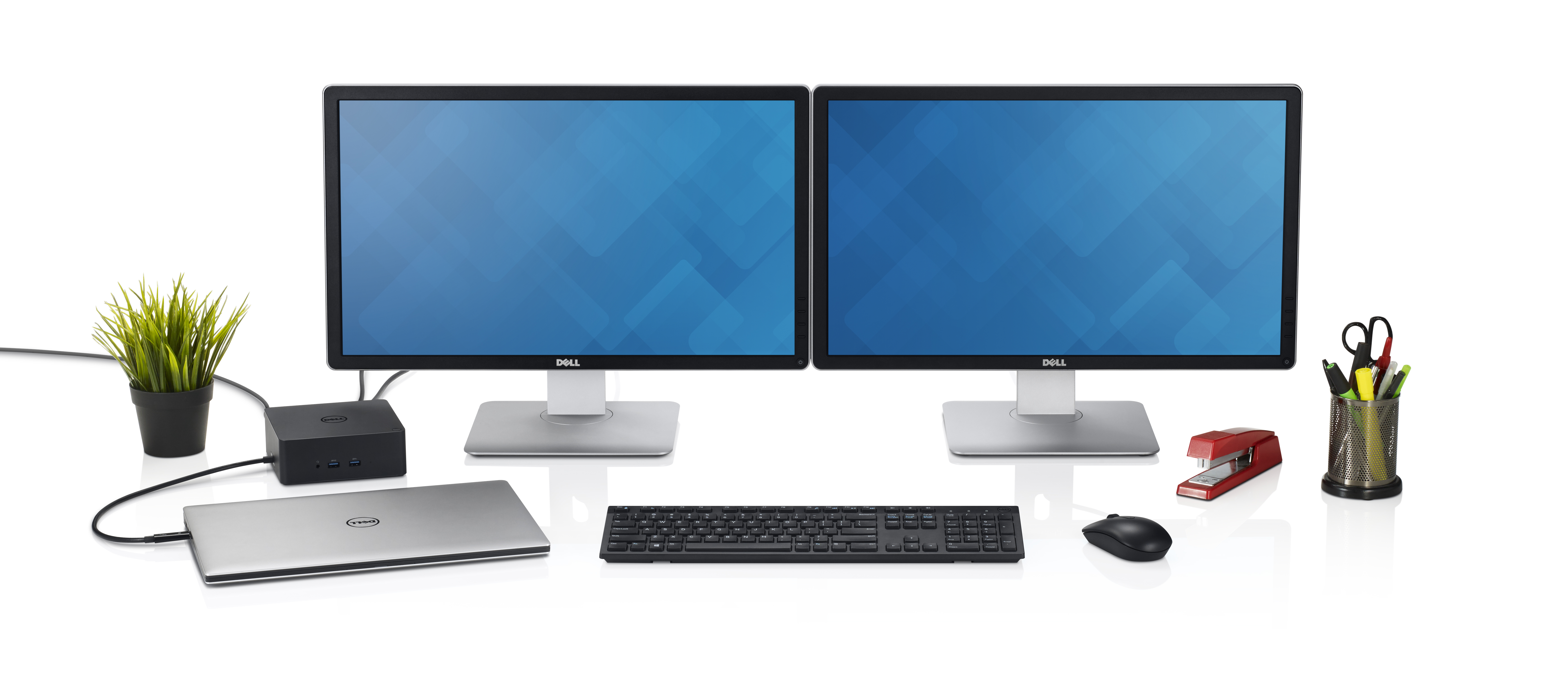 Un'impostazione da scrivania con due monitor, un laptop e una docking station. Sono presenti anche tastiera, mouse e accessori.