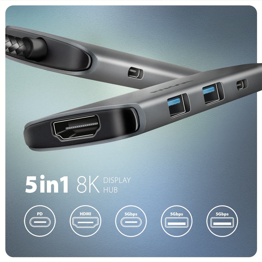 Hub argentato con porte. Mostra HDMI, USB e PD. L'hub è argentato.