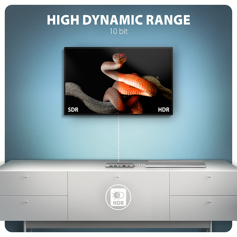 Schermo TV con immagine di un serpente e un hub su un mobile bianco. Sfondo blu.