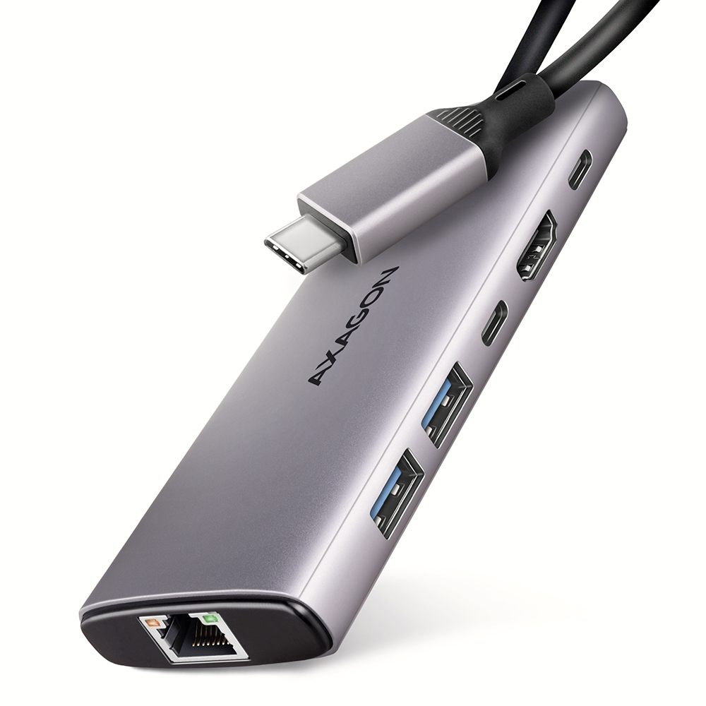 Hub USB grigio con più porte, HDMI e USB. Cavo nero, isolato su sfondo bianco.