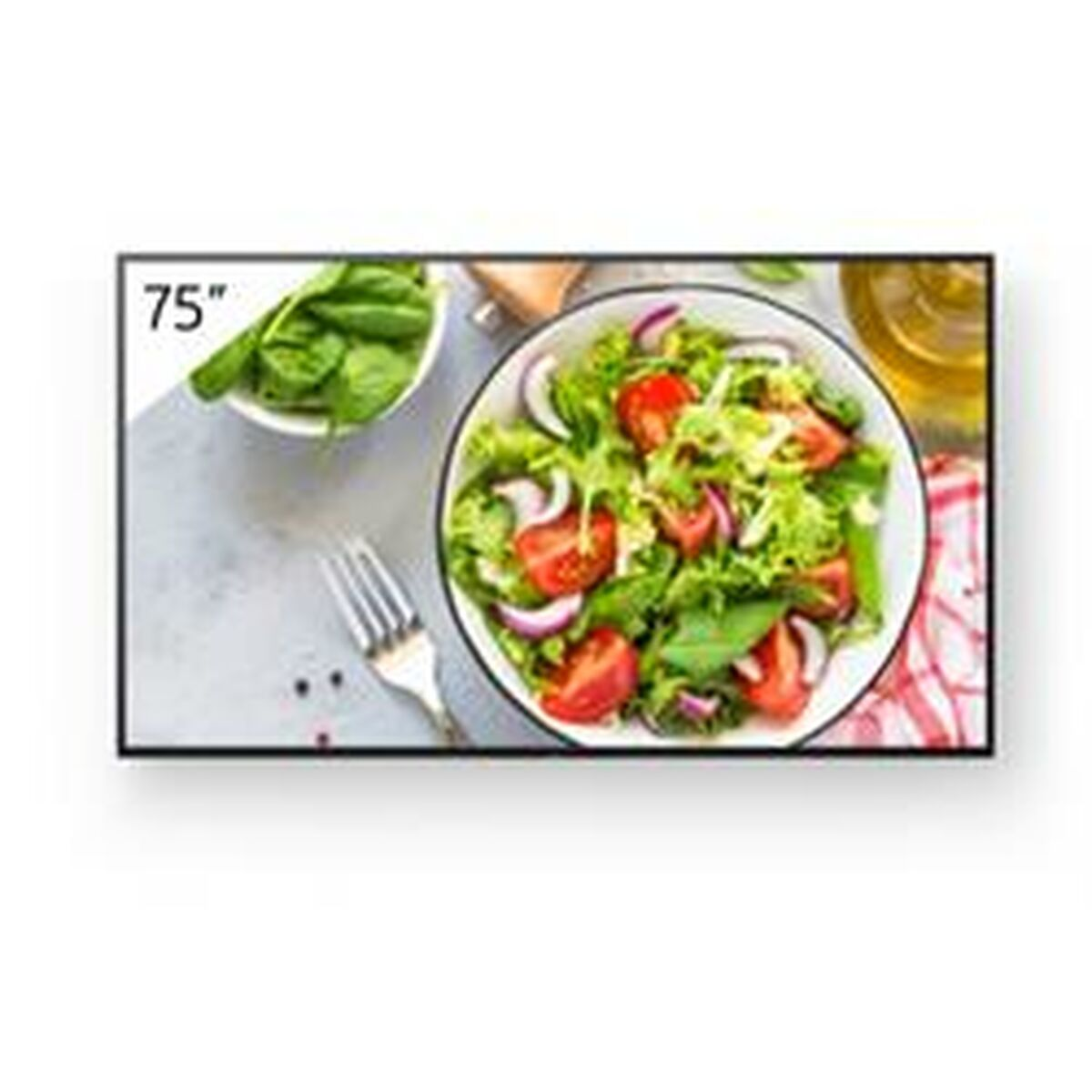 Televisor de 75 pulgadas que muestra una ensalada con tomates y cebollas en un cuenco blanco y un cuenco de espinacas.