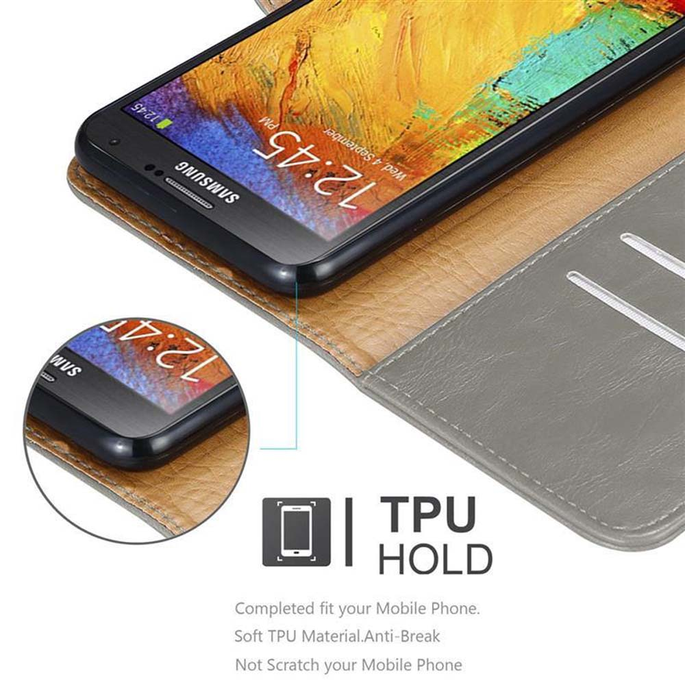 Un teléfono dentro de una funda gris. Texto: TPU HOLD. Ajuste completo para tu móvil.