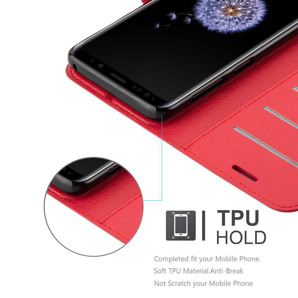 Rote Handyhülle und ein Telefon. Der Bildschirm ist schwarz mit Design.