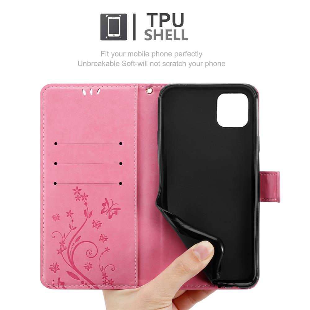 Una custodia per telefono rosa è aperta, che mostra un guscio di telefono nero e fessure per carte, con un design a farfalla.