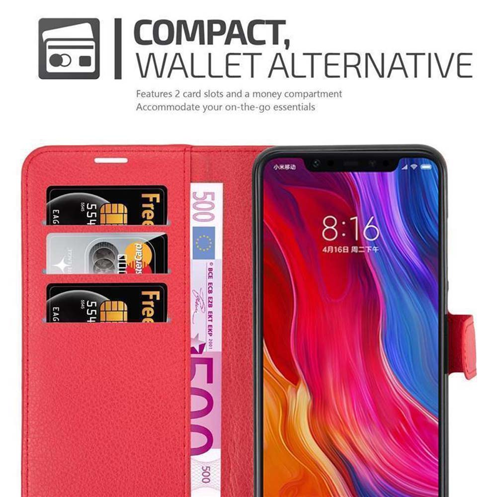 Funda roja para teléfono abierta, mostrando teléfono y billetera con tarjetas y dinero.