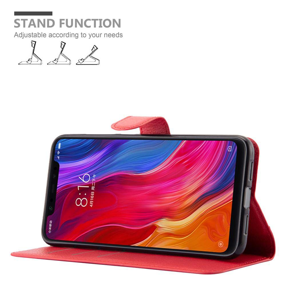 Teléfono en una funda roja, de pie, con pantalla colorida mostrando las 8:16.