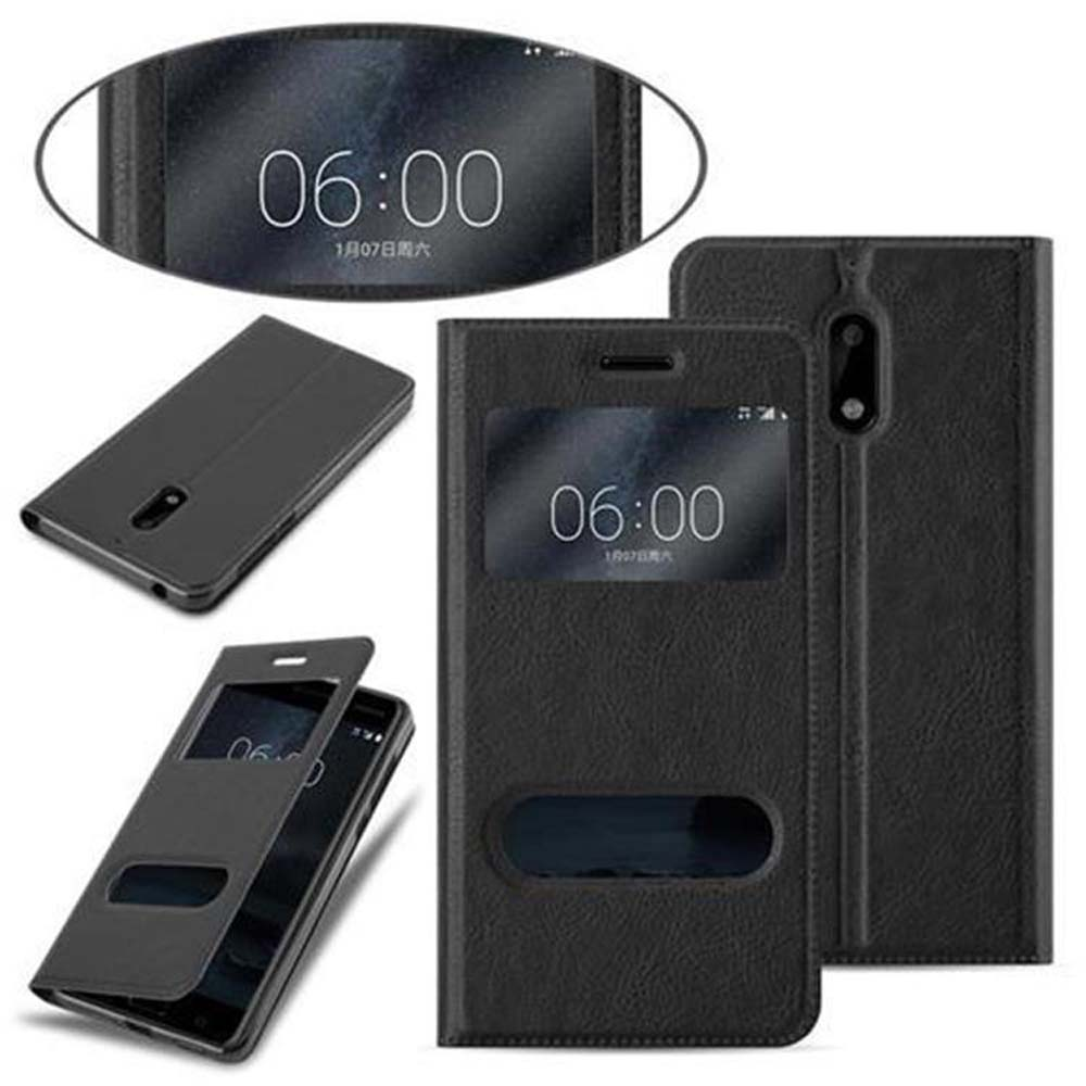 Custodia per telefono nera con finestra. Telefono dentro. Orario: 06:00. Custodia aperta e chiusa. Quattro immagini.