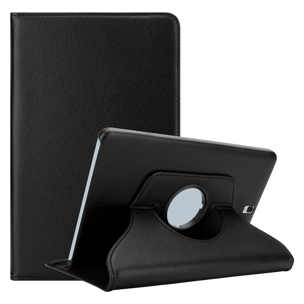 Una tableta negra en una funda de cuero. La tableta está en ángulo sobre un soporte. La funda está detrás.