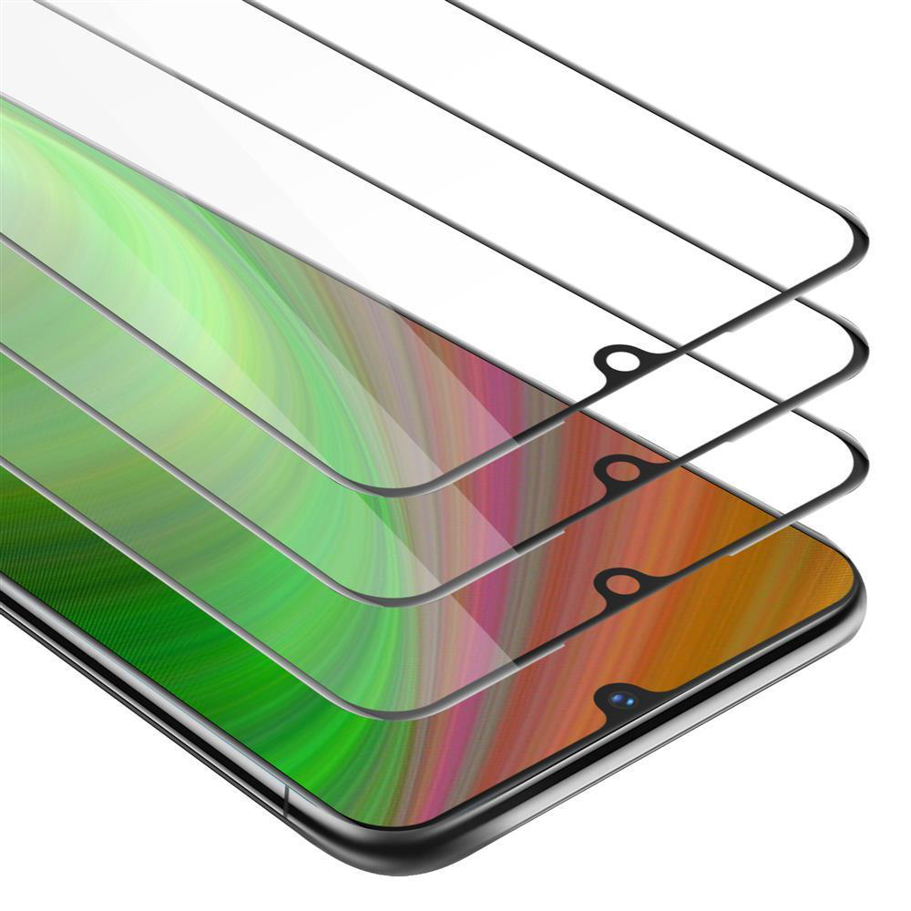 Tre protezioni schermo a strati. Sfondo verde e arancione visibile.