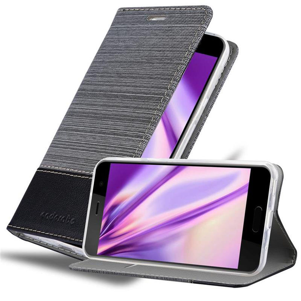 Un telefono in una custodia grigia e nera che mostra un'immagine viola sullo schermo.