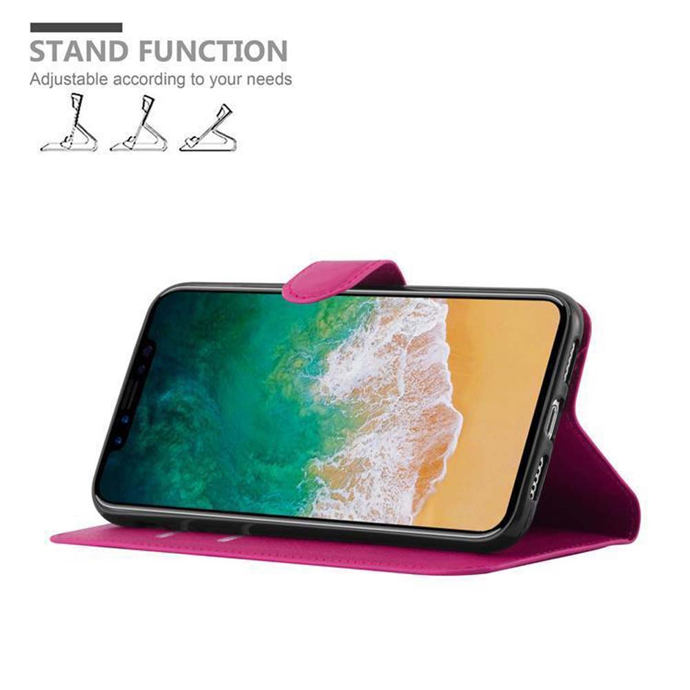 Telefono in una custodia rosa con funzione stand. Lo schermo mostra una scena sulla spiaggia. Funzione stand mostrata.