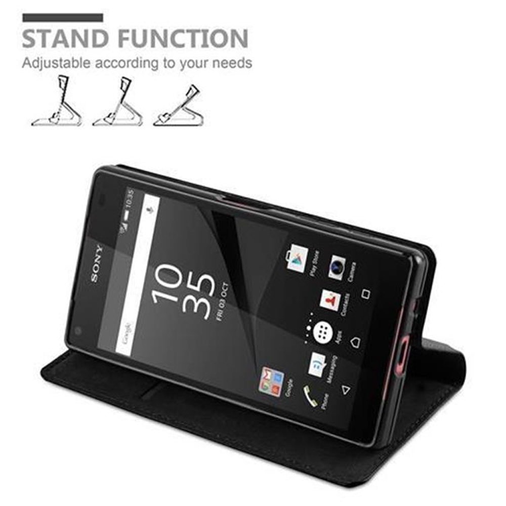 Telefono nero in custodia nera. Testo: Funzione stand, regolabile in base alle tue esigenze.