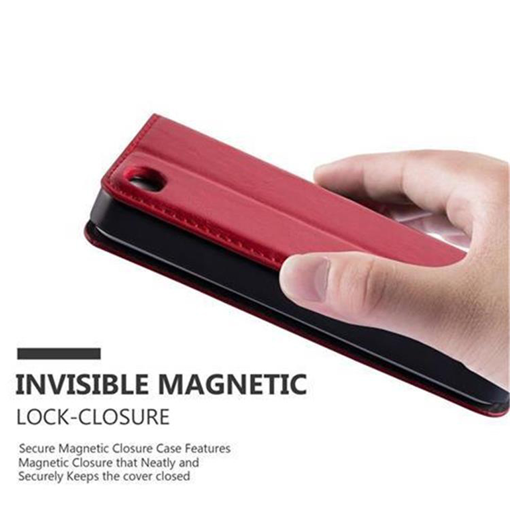 Mano che tiene una custodia rossa. Testo: Chiusura magnetica invisibile.