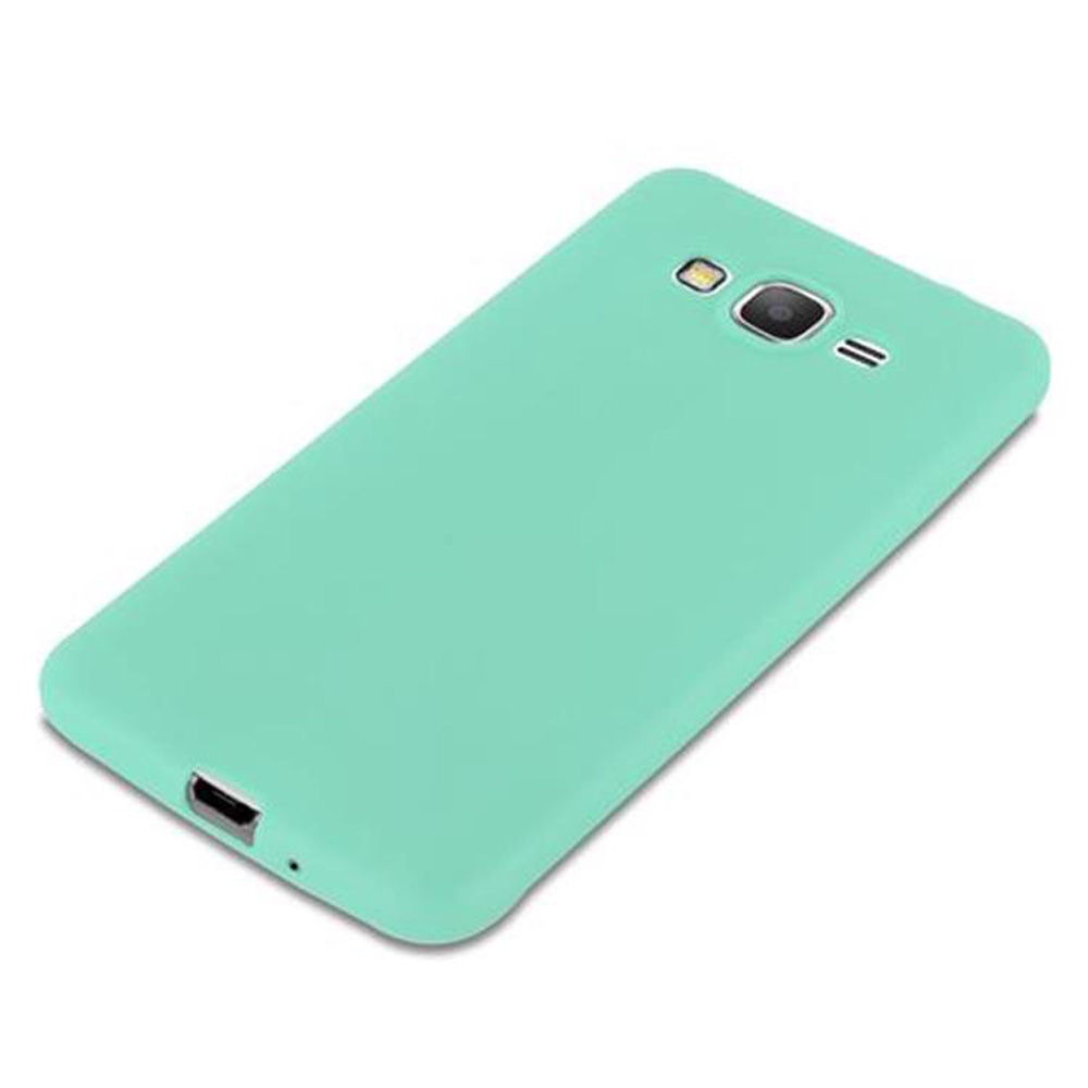 Un telefono verde chiaro è piatto. Ha una fotocamera e un flash, con una porta di ricarica in basso.