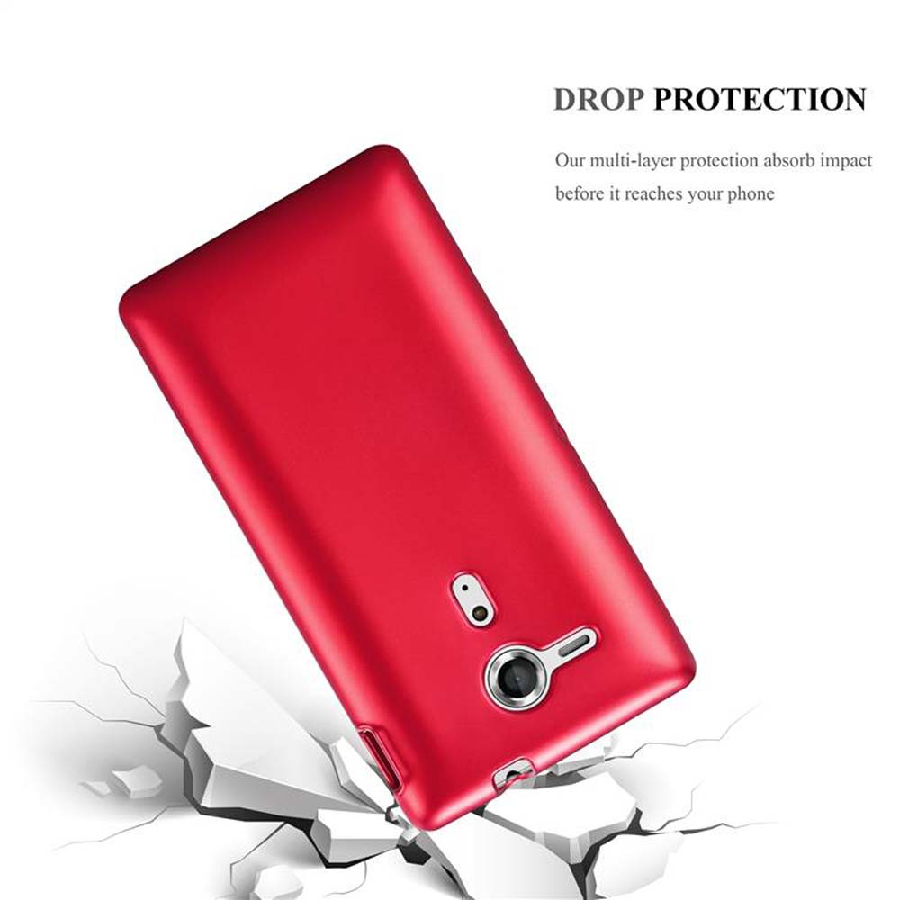 Una funda de teléfono roja cayendo con impacto. Aparecen grietas debajo. La funda es el foco de la imagen.