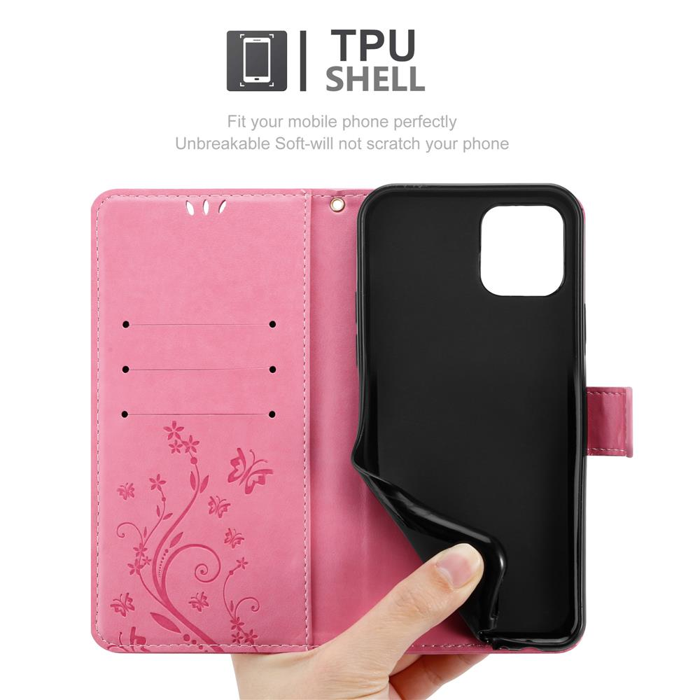 Custodia del telefono aperta in mano, rosa con design floreale, e un telefono nero all'interno.